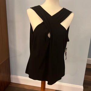 Black tank top blouse. Cross in the front.